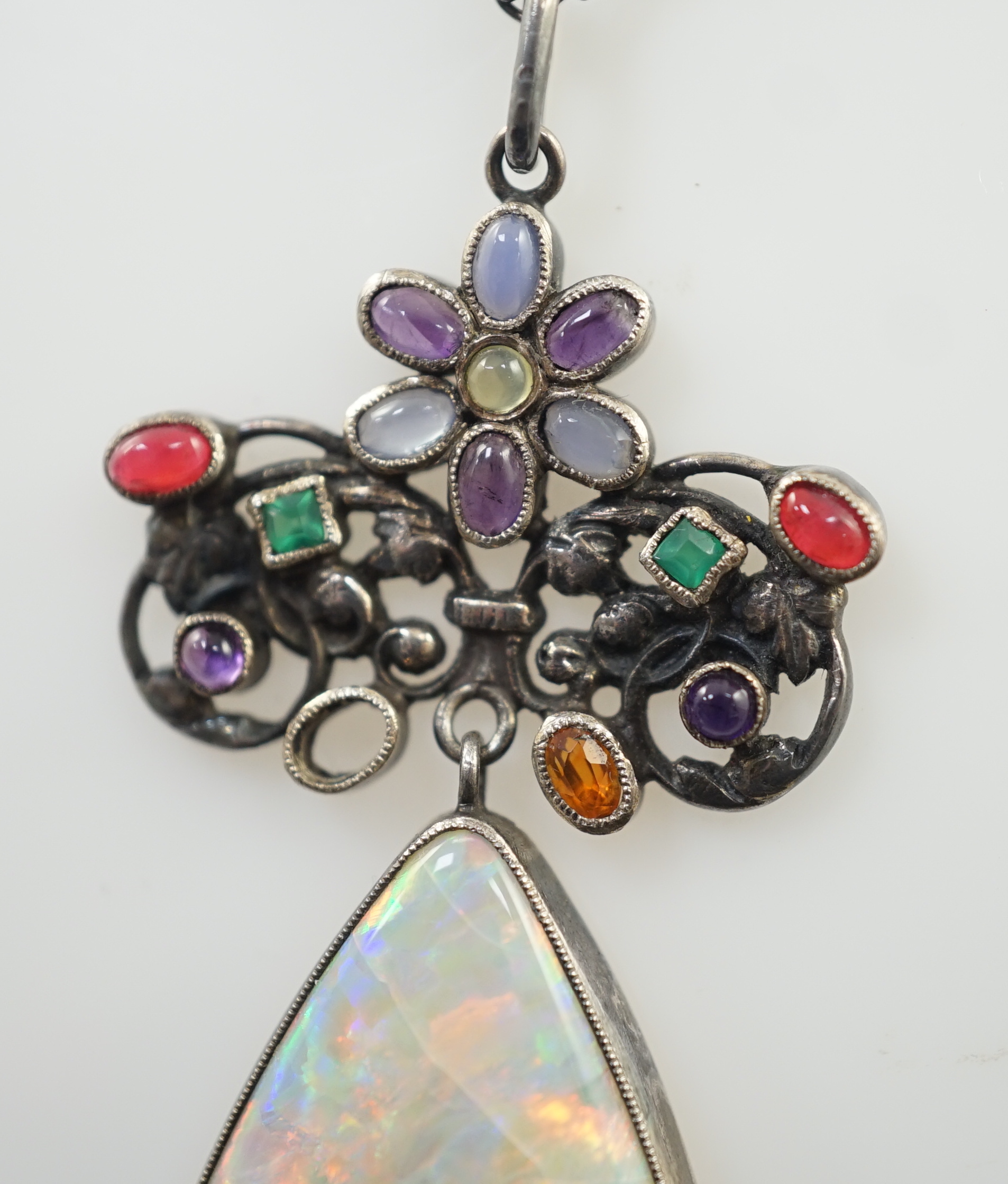 An early 20th century silver, white opal and cabochon gem cluster set drop pendant necklace, in the manner of Sibyl Dunlop